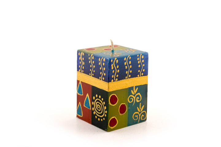African Mineral 2x2x3 cube candle. African designs in wonderful rich colors of turquoise, red, blues, purple, and gold.