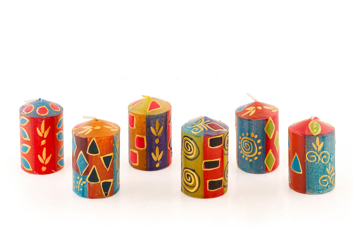 Six African Mineral votives in various patterns. African designs in wonderful rich colors of turquoise, red, blues, purple, and gold. The votives come in a 6-pack.