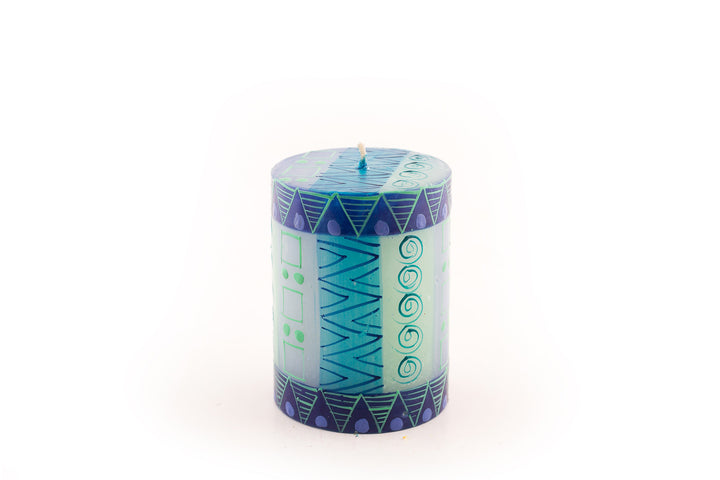 Blue & Green 3x4 pillar candle.  Indigo blue, turquoise, greens and touch of purple in various circle and triangle designs.