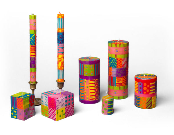 Carousel Candle Collection are hand painted in an array of wonderful bright colors. Fun and cheerful. Dinner tapers, pillar candles, cube candles and votive candles. Fair trade handmade in South Africa.