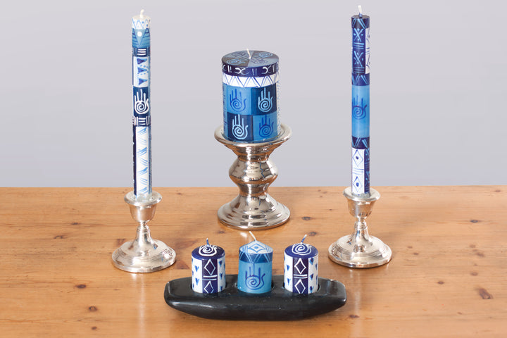Handmade and hand painted candles in Blue & White and include the Hamsa Hand to protect from evil spirits! Pictures are tapers, 3' x 4' pillar, and votive candles.
