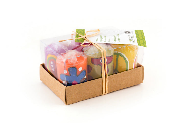 6 Votives come in a sustainable card gift box, tied with story card.