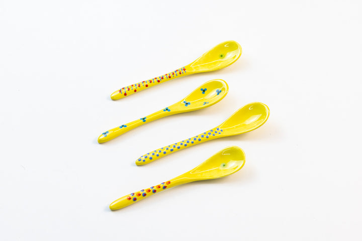 Small ceramic spoons with base color of Yellow. Tiny dots & flowers painted on top in light blue, red and orange. These are so sweet!