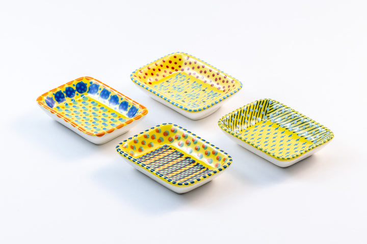 4 ceramic rectangle shape Tiny Bowls with Yellow base color. Dots & Stripes painted on top in red, blue, orange and jasper green.