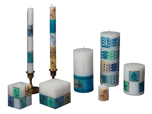 Arniston hand made and hand painted candle collection , inspired by the Arniston seaside village.  Fish, starfish, and sea shells are the painted images on the candles. Fair Trade.