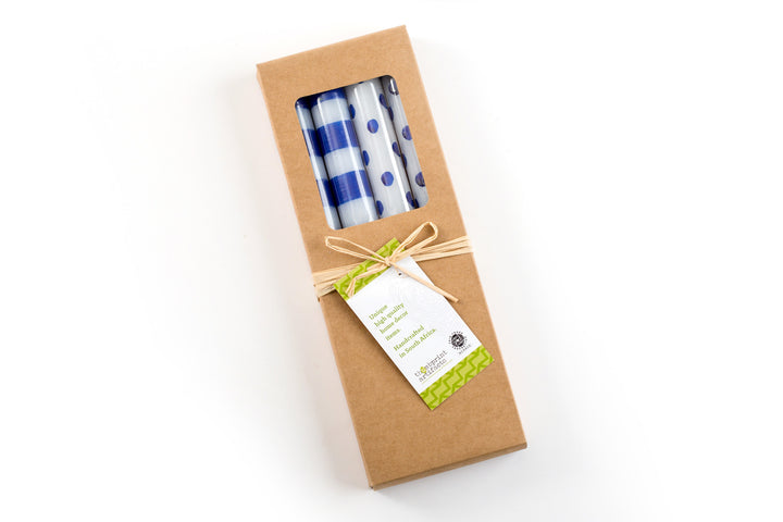 Gift box of the 4 white taper candles; two with blue dots and two with blue stripes