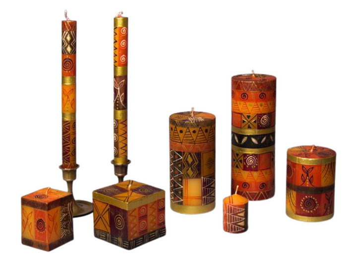 Safari Gold hand made and hand painted candle collection.  Hues of brown painted in squares and stripes with gold and dark brown ethnic design painted on top.  Fair Trade home decor.