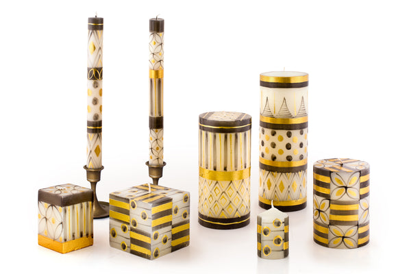 Celebration Black & Gold celebration candle collection.  Stunning!  Hand made and hand painted in South Africa. Fair Trade.  Dinner tapers, pillar candles, cube candles and votive candles.