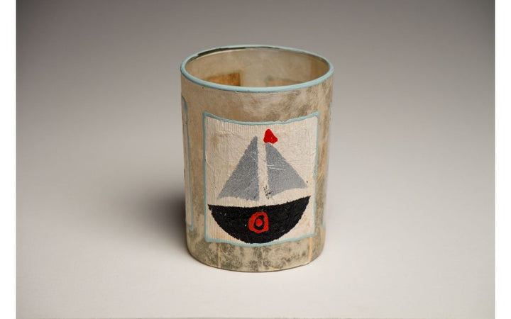 Tea light candles hand crafted using sail boats and light houses painted recycled teabags to make the designs. Fair trade home decor.