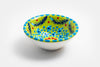 Tiny ceramic bowl, Lime green background with mixed patterns of dots & stripes in different sizes and colors. Microwave & Dishwasher safe.
