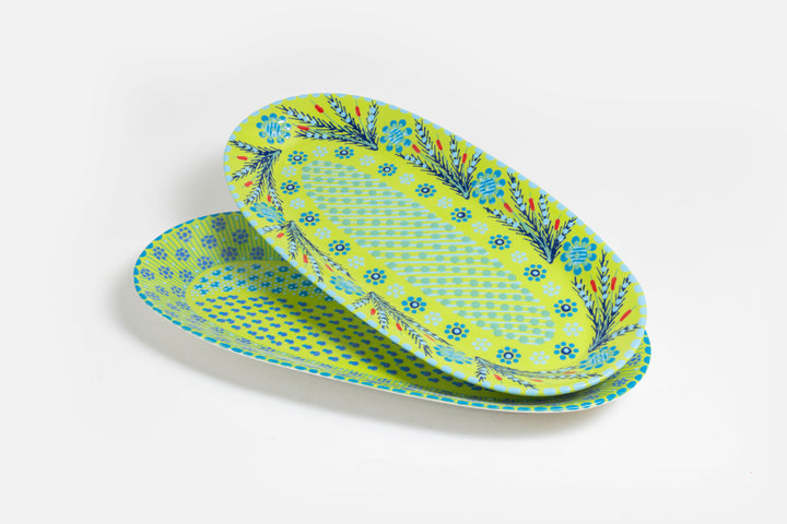 Two ceramic serving platters with Lime Green base color.  Dots & Stripes and flowers painted on top in red, yellow, indigo blue, and orange. Just beautiful!