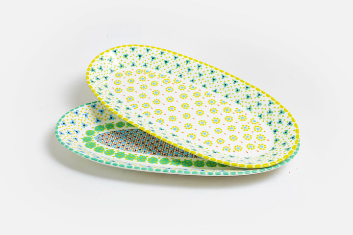 Two ceramic serving platters with White base color.  Dots & Stripes and flowers painted on top in red, yellow, indigo blue, lime green and orange. Just beautiful. Microwave and dishwasher safe.