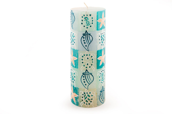 Arniston 3 x 8 pillar.  Sea shells, star fish and turtles are painted on the pillar candle in turquoise, cream, blue and sea green.  Base candle is white.