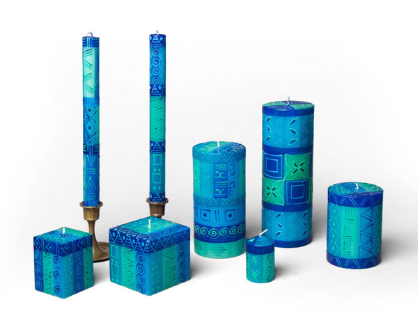 Blue & Green hand painted candle collection. Wonderful hues of blue with touches of sea green. Available in taper candles, pillar candles, cube candles and votive candles. Fair Trade.
