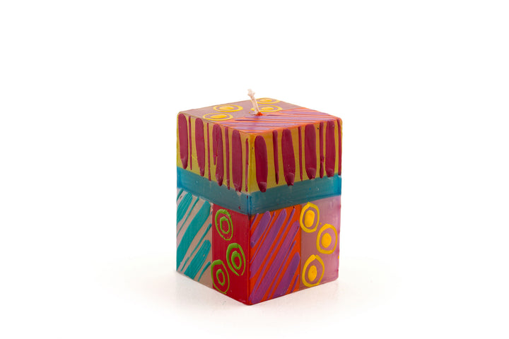 Carousel 2x2x3 cube candle.Dots, stripes and circles in pinks, purple, yellow, orange, greens and turquoise! 