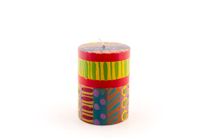 Carousel 34 pillar candle. Dots, stripes and circles in pinks, purple, yellow, red, greens and turquoise! 
