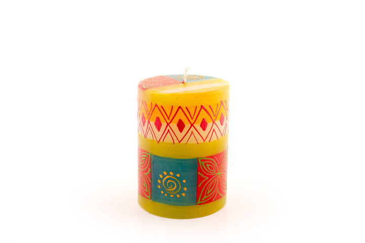 Desert Rose 3x4 pillar candle. Beautiful colors of the African desert; golden yellow, turquoise blue, browns, orange painted in blocks of color with abstract patterns on top.