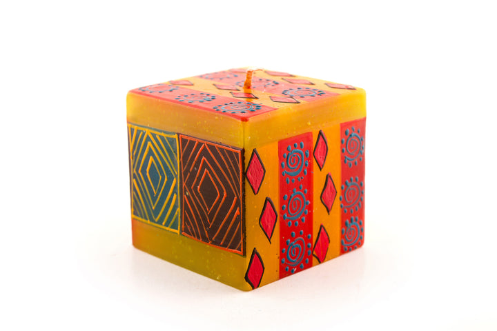 Desert Rose 3x3x3 cube candle. Beautiful colors of the African desert; golden yellow, turquoise blue, browns, orange painted in blocks of color with abstract patterns on top.