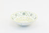 White large round ceramic serving bowl. 11"x 3".  White background, painted with yellow, green, touches of red, and baby blue.  Microwave & Dishwasher safe.