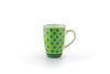 Colorful coffee mug with lime green base color.  Topped with dots & stripes in turquoise, orange, green, & indigo blue.  White inside. Very fun!