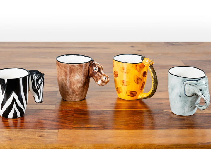 Collect all 4 of these animal mugs, from left, zebra, hippo, giraffe, and elephant!