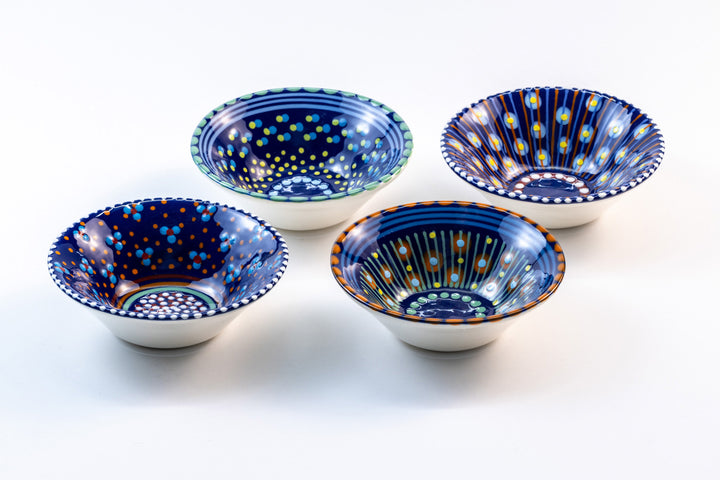4 Mini Nut bowls with Indigo Blue  base color. Dots & Stripes on top in orange, red, turquoise, jasper green & yellow. Each bowl with a unique design.