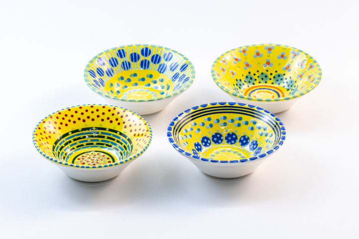 4 Mini Nut bowls with yellow base color. Dots & Stripes on top in orange, red, turquoise, indigo & jasper green. Each bowl with a unique design.