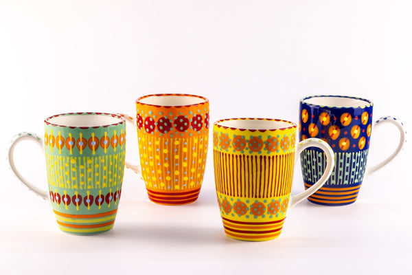4 VERY colorful coffee mugs; base colors of Jasper Green, Orange, Yellow & Indigo Blue.  Topped with orange, yellow, green & red dots and stripes. White inside.