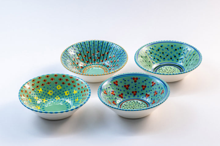4 'nut' size ceramic bowls with Jasper green base color. Dots & Stripes painted on top in orange, blue, yellow  & turquoise blue.