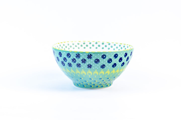 Ceramic serving bowl with base color of Jasper Green. Dots & Stripes painted on top in fun colors of yellow, turquoise &  Indigo Blue. White inside the bowl.