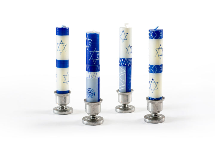 Blue Star of David design hand painted on white 4" taper Shabbat candles. 4 different designs displayed in small pewter taper holders.  Fair Trade made in South Africa.