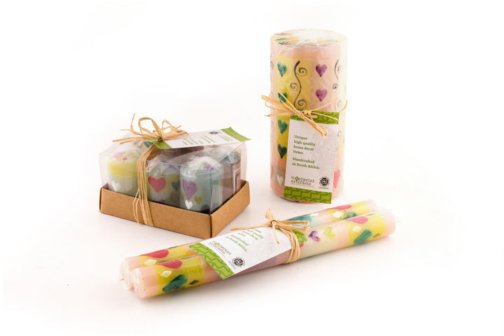 Packaging presentation of the various candles; votive 6-pack, 3x6 pillar and taper pair.  Each candle is individually wrapped and come with a story card.