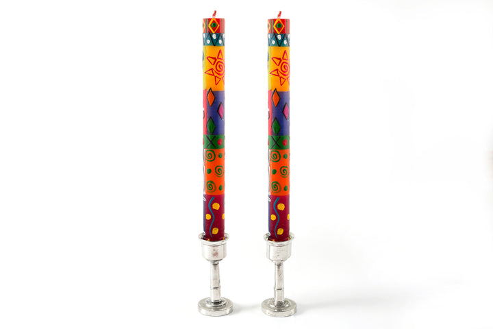 Matched pair of Muticolor Ethnic tapers in pewter candle holders. Bright, colorful, sunshines and fun designs that sing out Africa!