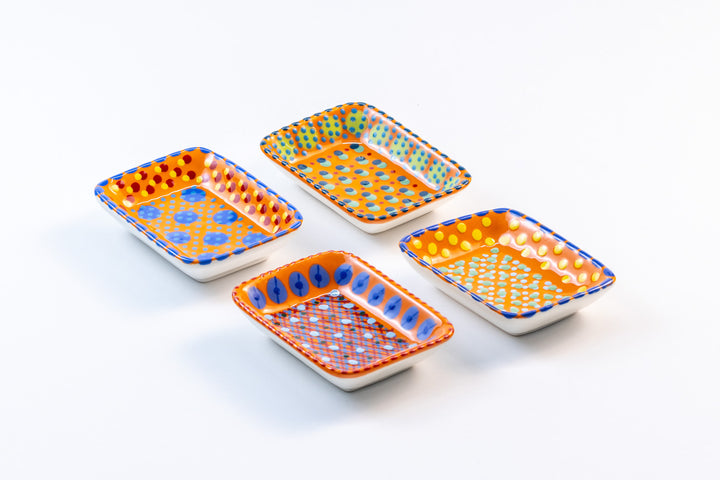 4 ceramic rectangle shape Tiny Bowls with Orange base color. Dots & Stripes painted on top in yellow, red, blue and jasper green.