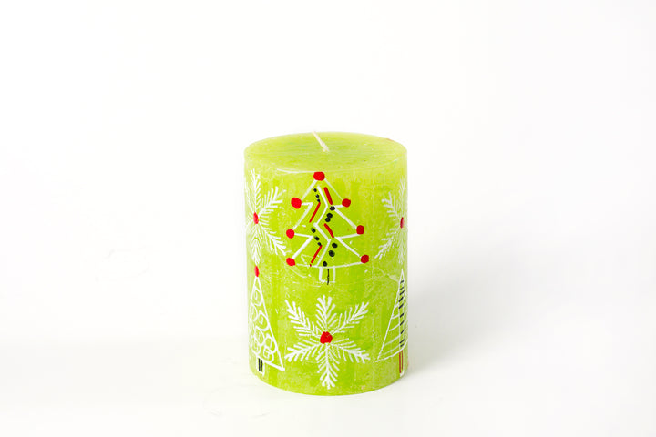 Whimsy Christmas 3" x 4" Pillar Candle. This one has a green base color and hand painted with trees, snow flakes and Christmas ornaments in white with red, green highlights.