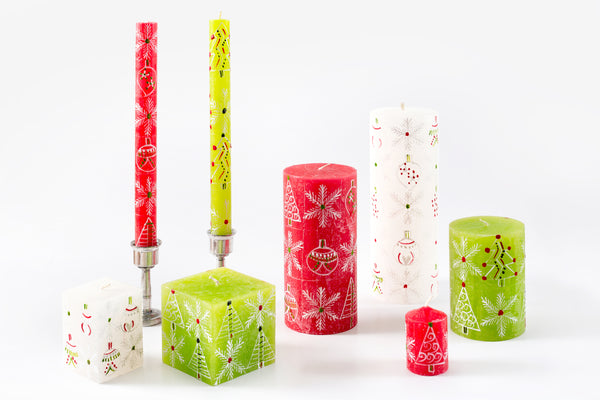 Whimsy Christmas Candles collection is just that ! Whimsy Christmas trees, snow flakes and Christmas ornaments hand painted in white on red, green and/or white candles. Touches of green and red. Fair Trade home decor.