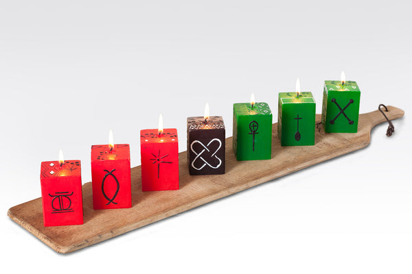 Kwanzaa Cube Collection of the 7 cube candles,  each cube carries a different traditional Kwanzaa symbol. Fair Trade home decor.