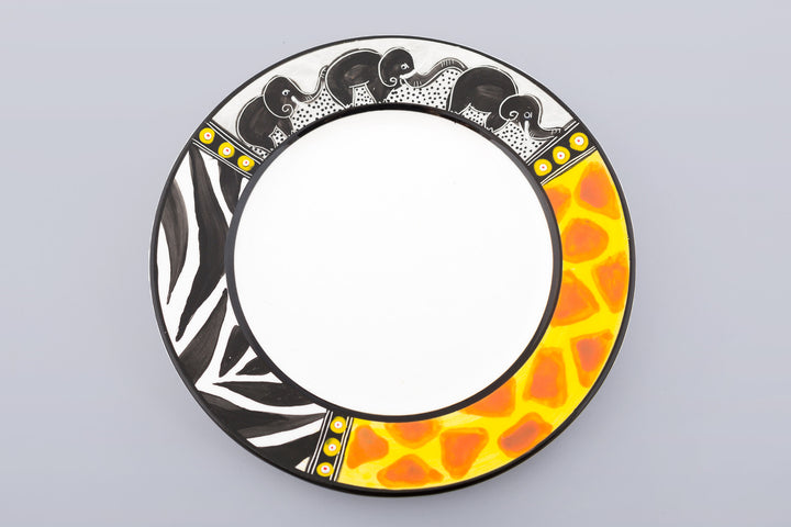 Whimsy Animal print side plate on grey background. ! White plate with the rim painted in zebra & giraffe print and three small elephants in a line - trunks up for Good Luck!