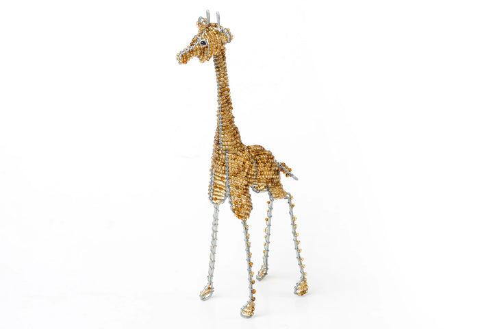 Beaded giraffe made from recycled wire and golden beads in South Africa.