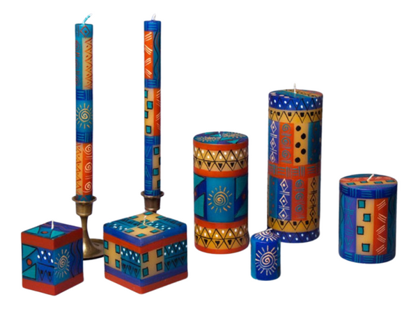 African Sky hand made and hand painted candle collection.  Dinner tapers, pillar candles, cube candles, and votive candle 6-pack. Fair Trade.
