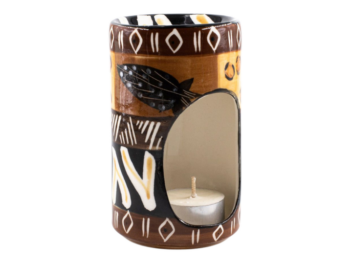 Animal Print Ceramic Burner. Tea light in bottom that glows through the opening while scent burns on top.  Animal Print patterns painted on side. Fair Trade.
