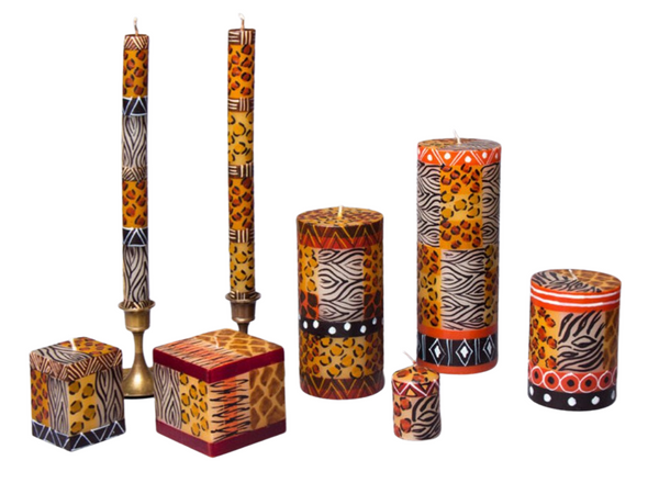 Animal Print hand made and hand painted candle collection.  Each candle is painted  with all the 'prints' of african animals.  Dinner tapers, pillar candles, cube candles, and votive candles. Fair Trade.