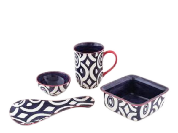 Batik Hand made and hand painted ceramic collection.  Blue and white geometric designs with touches of red trim and dark blue inside.  Muge, small bowl, small square, and spoon rest. Fair Trade. 