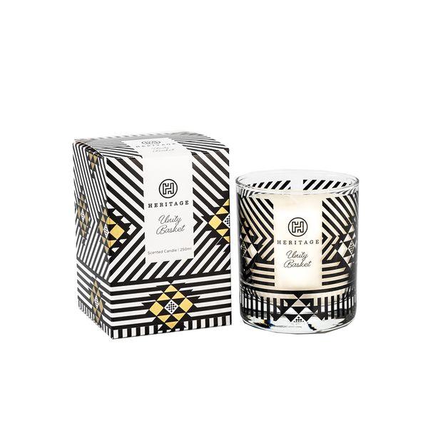 The Unity Basket 250ml scented candle and gift box.  The box is in the black & gold pattern of the Zulu basket given at weddings to represent the woven strength of the marriage and family.  The glass jar of the candle has the same black pattern.