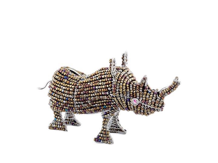 Beaded rhino figurine made of recycled silver wire and a mix of opaque and transparent beads. Metallic hues of silver, gold, copper, with pops of teal, cobalt blue, and red. Fair Trade Decor. Fair Trade Gifts. Handmade Gifts. Handmade Decor. Handbeaded.