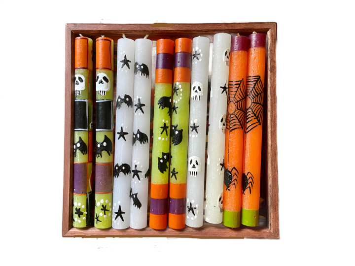 Five variations of the Halloween candle! Bats, stars, skulls, spider webs! In black, white, orange, purple, and lime green.  All handmade and hand painted. Fair trade.