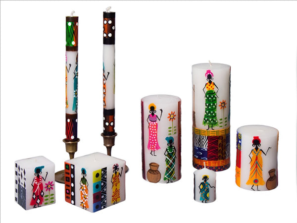 African Ladies candlle collection. Tapers, pillars and cubes all with whimsy African Ladies painted on the side. Hand made. Fair Trade.