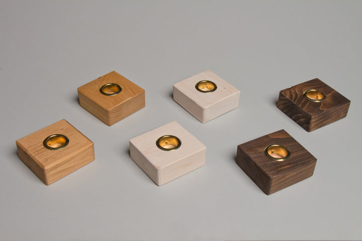 Taper Candle Holders hand crafted by Detroit artisans out of reclaimed wood, available in 3 colors.