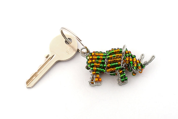 Beaded rhino key chain.  Handmade in green & golden beads.  Cute!  Fair trade products.