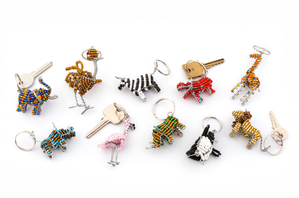 The selection of beaded African animals key chains; elephant, ostrich, zebra, hippe, giraffe, warthog, pink flamingo, rhino, penguin, & lion. Colorful, fun and cute. 